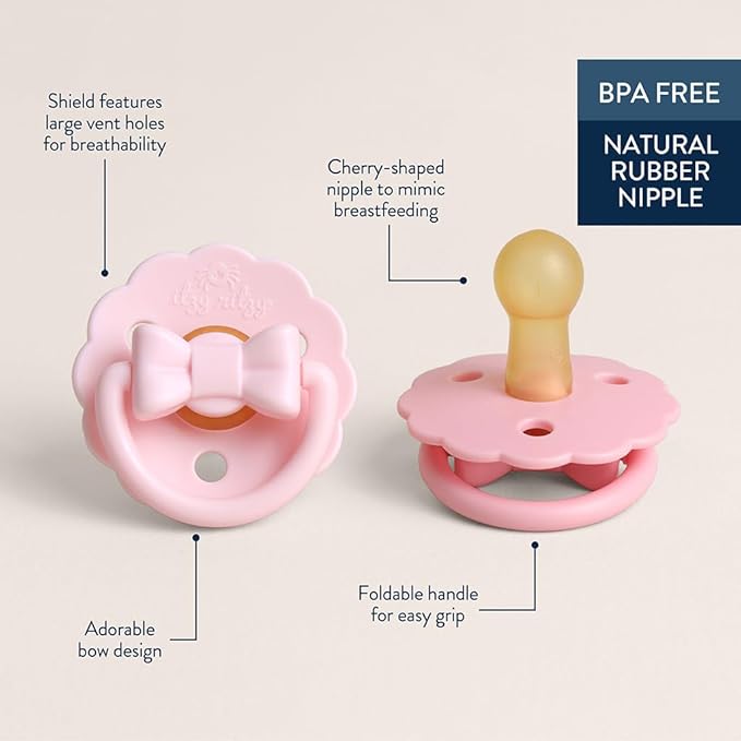 Itzy Ritzy Natural Rubber Pacifiers – Baby Pacifiers with Cherry-Shaped Nipple & Large Air Holes for Added Safety - Set of 2 Binkies in Light Pink & Dark Pink Bows (Ages 0 – 6 Months)