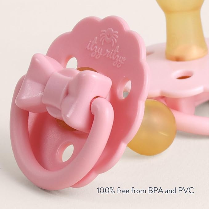 Itzy Ritzy Natural Rubber Pacifiers – Baby Pacifiers with Cherry-Shaped Nipple & Large Air Holes for Added Safety - Set of 2 Binkies in Light Pink & Dark Pink Bows (Ages 0 – 6 Months)