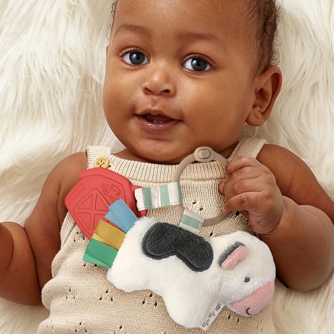 Itzy Ritzy Infant Toy & Teether - Itzy Pal Baby Teething Toy Includes Lovey, Crinkle Sound, Textured Ribbons & Silicone Teether for Newborn (Cow)