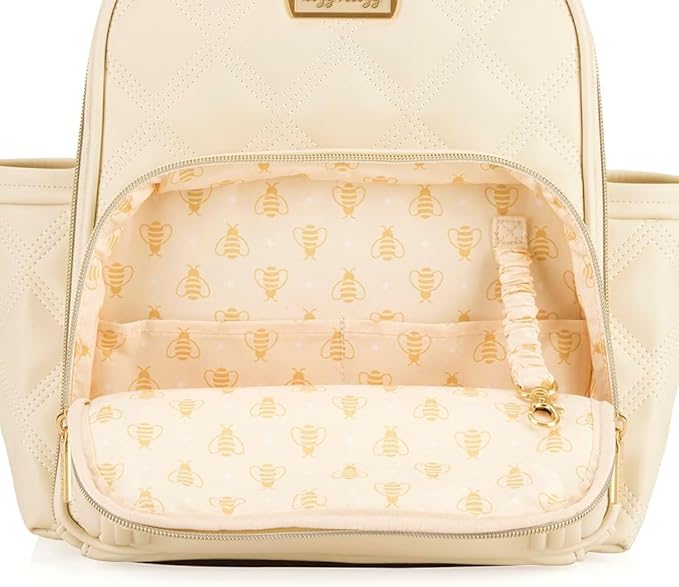 Itzy Ritzy Mini Diaper Bag Backpack – Chic, Compact Mini Plus Backpack with Changing Pad, 10 Pockets (6 Internal, 4 External), Grab-Top Handle & Rubber Feet (Milk & Honey)