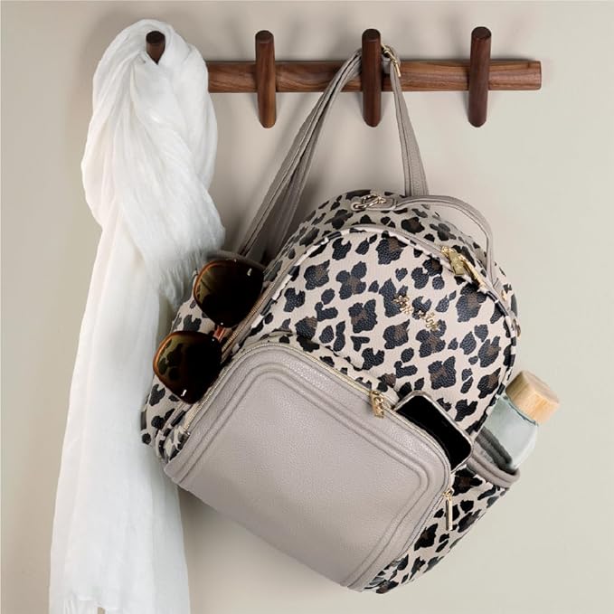 Itzy Ritzy Mini Diaper Bag Backpack – Chic, Compact Mini Plus Backpack with Changing Pad, 10 Pockets (6 Internal, 4 External), Grab-Top Handle & Rubber Feet (Leopard)