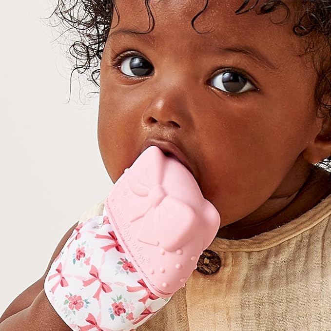 Itzy Ritzy Silicone Teething Mitt - Soothing Infant Teething Mitten with Adjustable Strap, Crinkle Sound & Textured Silicone to Soothe Sore & Swollen Gums - for Ages 3 Months & Up (Bow)
