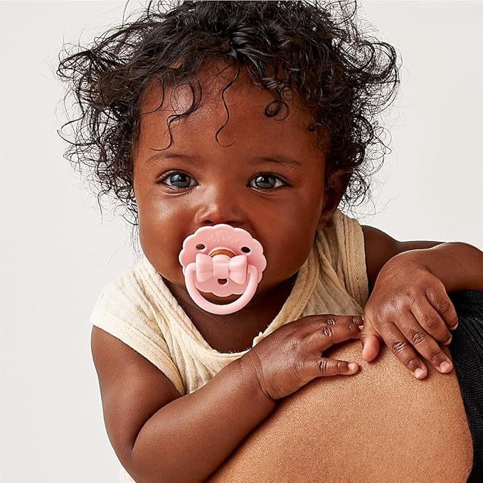 Itzy Ritzy Natural Rubber Pacifiers – Baby Pacifiers with Cherry-Shaped Nipple & Large Air Holes for Added Safety - Set of 2 Binkies in Light Pink & Dark Pink Bows (Ages 0 – 6 Months)