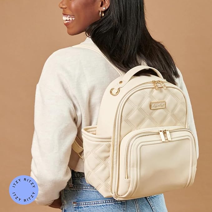 Itzy Ritzy Mini Diaper Bag Backpack – Chic, Compact Mini Plus Backpack with Changing Pad, 10 Pockets (6 Internal, 4 External), Grab-Top Handle & Rubber Feet (Milk & Honey)