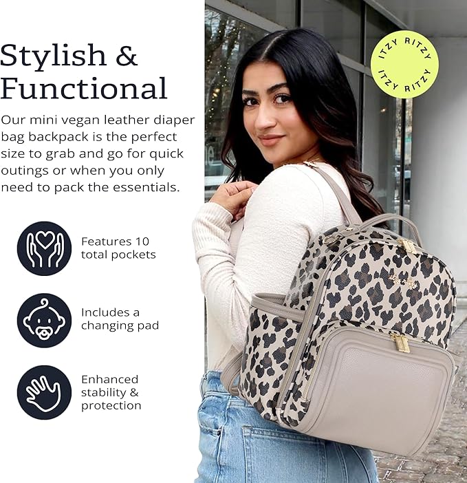 Itzy Ritzy Mini Diaper Bag Backpack – Chic, Compact Mini Plus Backpack with Changing Pad, 10 Pockets (6 Internal, 4 External), Grab-Top Handle & Rubber Feet (Leopard)