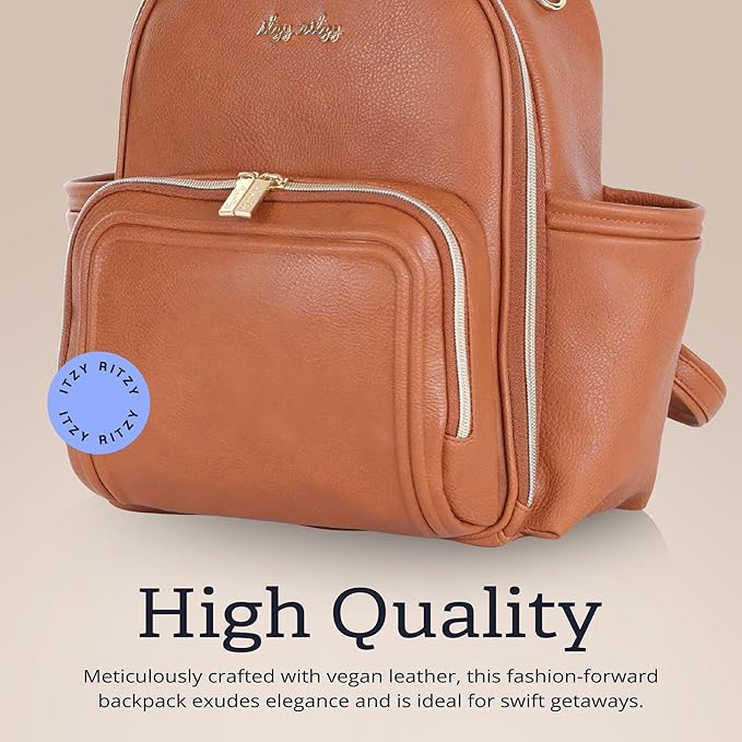 Itzy Ritzy Mini Diaper Bag Backpack – Chic, Compact Mini Plus Backpack with Changing Pad, 10 Pockets (6 Internal, 4 External), Grab-Top Handle & Rubber Feet (Cognac)